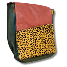 Multicolored bag with leopard print section on a white background