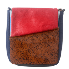 Multicolored leather bag with red, blue, and brown sections on a white background