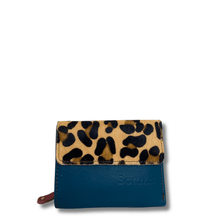 Blue wallet with leopard print flap on a white background