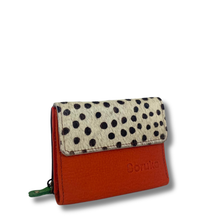 Wallet with polka dot flap and orange body on a white background