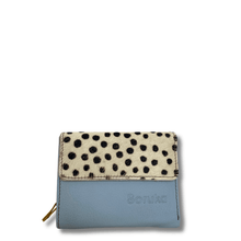Blue wallet with a spotted flap on a white background