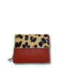 Small wallet with leopard print top section and red bottom section on a white background