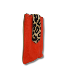 Red phone case with leopard print accent on a white background