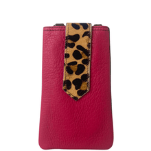 Pink phone case with a leopard print strap on a white background
