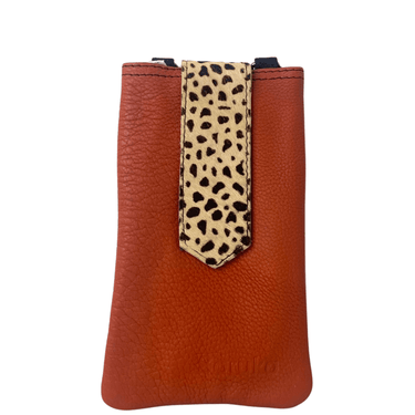 Brown leather phone case with a cheetah print strap on a white background