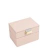 A light pink double-tier jewelry box with a gold-tone clasp and a silver-tone accent, shown on a plain white background.