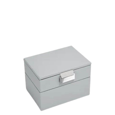 A light gray rectangular storage box with a hinged lid and a silver metal latch, shown on a plain white background.
