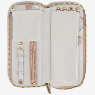 Open travel organizer with compartments on a white background