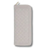 Quilted jewellery case with zipper on a white background