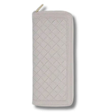 Quilted jewellery case with zipper on a white background