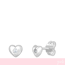 Heart-shaped silver earrings with clear gemstones on a white background