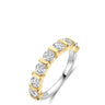 A diamond eternity ring featuring round-cut clear diamonds set in a yellow gold band with a polished silver-colored inner band, shown on a white background.