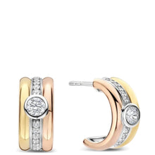 Two pairs of double-hoop earrings in yellow gold and rose gold with pavé-set clear stones and a central round-cut stone, shown on a plain white background.