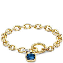 A gold chain bracelet with a blue square pendant, featuring a twisted rope charm and a small diamond accent, shown on a white background.