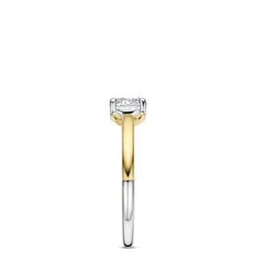 A two-tone diamond engagement ring featuring a round brilliant-cut diamond set in a yellow gold and white gold/platinum split-shank band, shown against a plain white background.