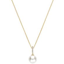 A delicate gold chain necklace featuring a single lustrous white pearl pendant, accented by a small gold bar set with tiny clear stones at the bail.
