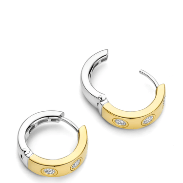 Pair of gold and silver hoop earrings with embedded stones on a white background
