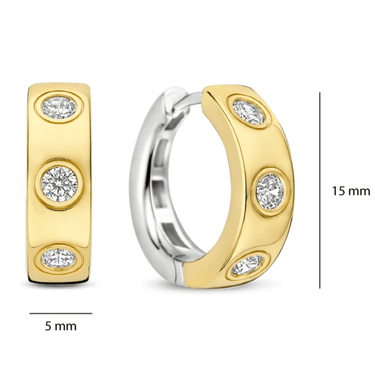 Gold hoop earrings with embedded diamonds on a white background