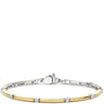 A two-tone metal bracelet featuring a polished yellow gold tube accented by small round clear stones, set in a silver-toned bangle. The image is shot on a plain white background with the bracelet positioned in the lower half of the frame.