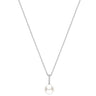 A delicate silver chain necklace featuring a single white pearl pendant set in a small silver bezel with tiny clear accent stones, shown against a solid white background.