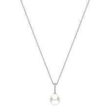 A delicate silver chain necklace featuring a single white pearl pendant set in a small silver bezel with tiny clear accent stones, shown against a solid white background.