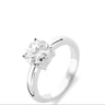 A silver solitaire engagement ring with a round brilliant-cut clear gemstone in a four-prong setting, shown on a plain white background.