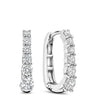 A pair of silver huggie hoop earrings with a row of clear round-cut gemstones, shown from front and side angles on a white background.