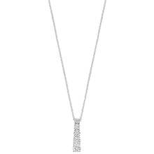 A delicate silver-toned necklace featuring a vertical bar pendant paved with small clear stones, set against a solid white background.