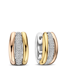 Pair of gold and silver hoop earrings with embedded stones on a white background