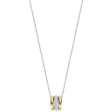 Necklace with a gold and silver pendant on a white background
