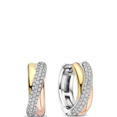 Pair of gold and silver hoop earrings on a white background
