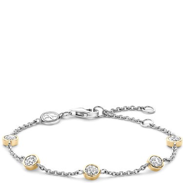 Silver bracelet with gold accents on a white background