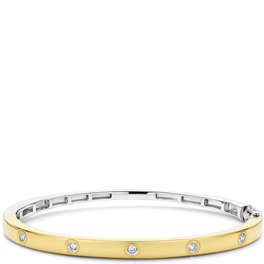 Gold and silver bracelet with small diamonds on a white background