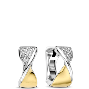 Pair of gold and silver earrings on a white background