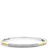A two-tone bangle bracelet featuring a polished yellow gold outer band and a pavé-set silver-toned center section with clear stones, shown against a plain white background.