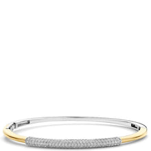 A two-tone bangle bracelet featuring a polished yellow gold outer band and a pavé-set silver-toned center section with clear stones, shown against a plain white background.