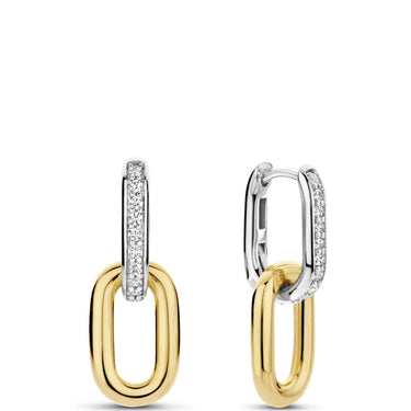 Gold and silver hoop earrings on a white background