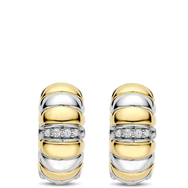 Pair of gold and silver earrings with diamond accents on a white background