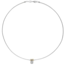 A delicate silver chain necklace with a small central charm featuring two gold-toned beads and a clear gemstone, displayed on a solid white background.