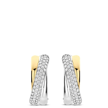 Gold and silver hoop earrings with embedded stones on a white background