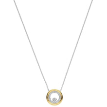 A delicate silver chain necklace featuring a circular pendant with a polished gold outer ring, a smaller inner ring paved with clear stones, and a central clear gemstone, shown against a plain white background.