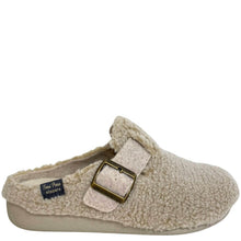 A single beige sherpa fleece clog slipper with a wide strap and a gold-tone buckle, shown from a side profile on a white background. A brand label for 'Kate Perry Slippers' is visible inside the shoe.
