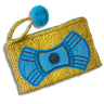 Yellow woven clutch with blue beaded bow design and blue pom-pom on a white background