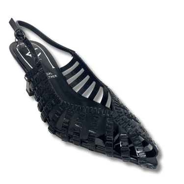 Black sandal with a unique strap design on a white background