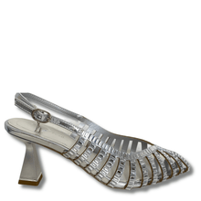 Silver high-heeled shoe with clear strap on a white background