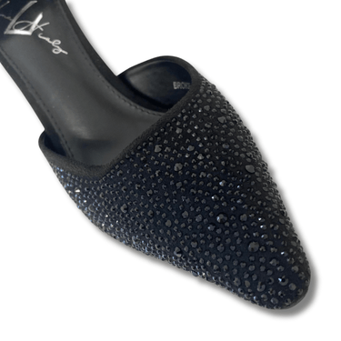 Black stiletto shoe with rhinestone embellishments on a white background