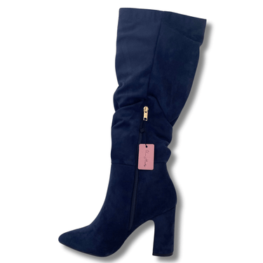 Navy blue knee-high boot with a pink tag on a white background