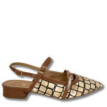 Brown sandal with snake print toe on a white background