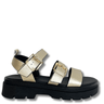 Gold and black sandal with platform sole on a white background