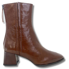 A brown leather ankle boot with a side zipper, block heel, and pointed toe, shown against a plain white background.